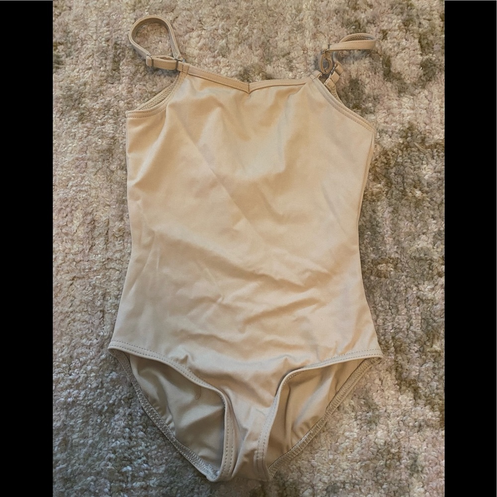 Girls Capezio Nude colored bodysuit for dance